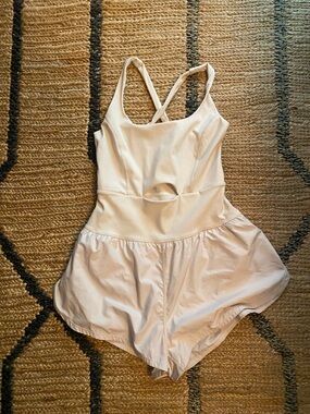 FP Movement by Free People Ivory Cross-Back Cutout Romper. Righteous Onsie.